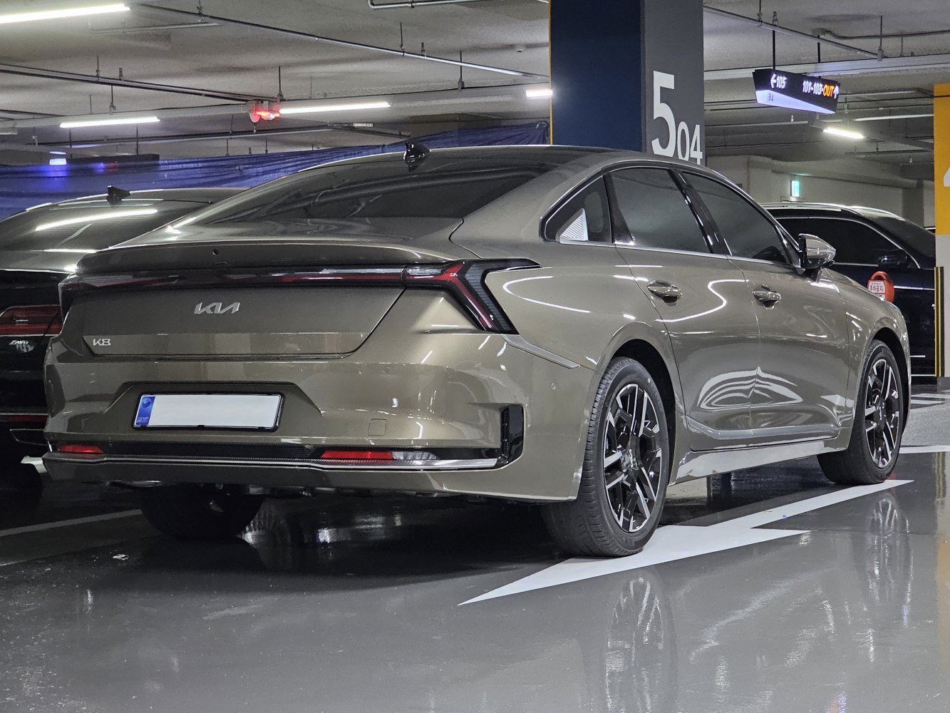Rear view of a sedan with sharp LED taillights and modern alloy wheels