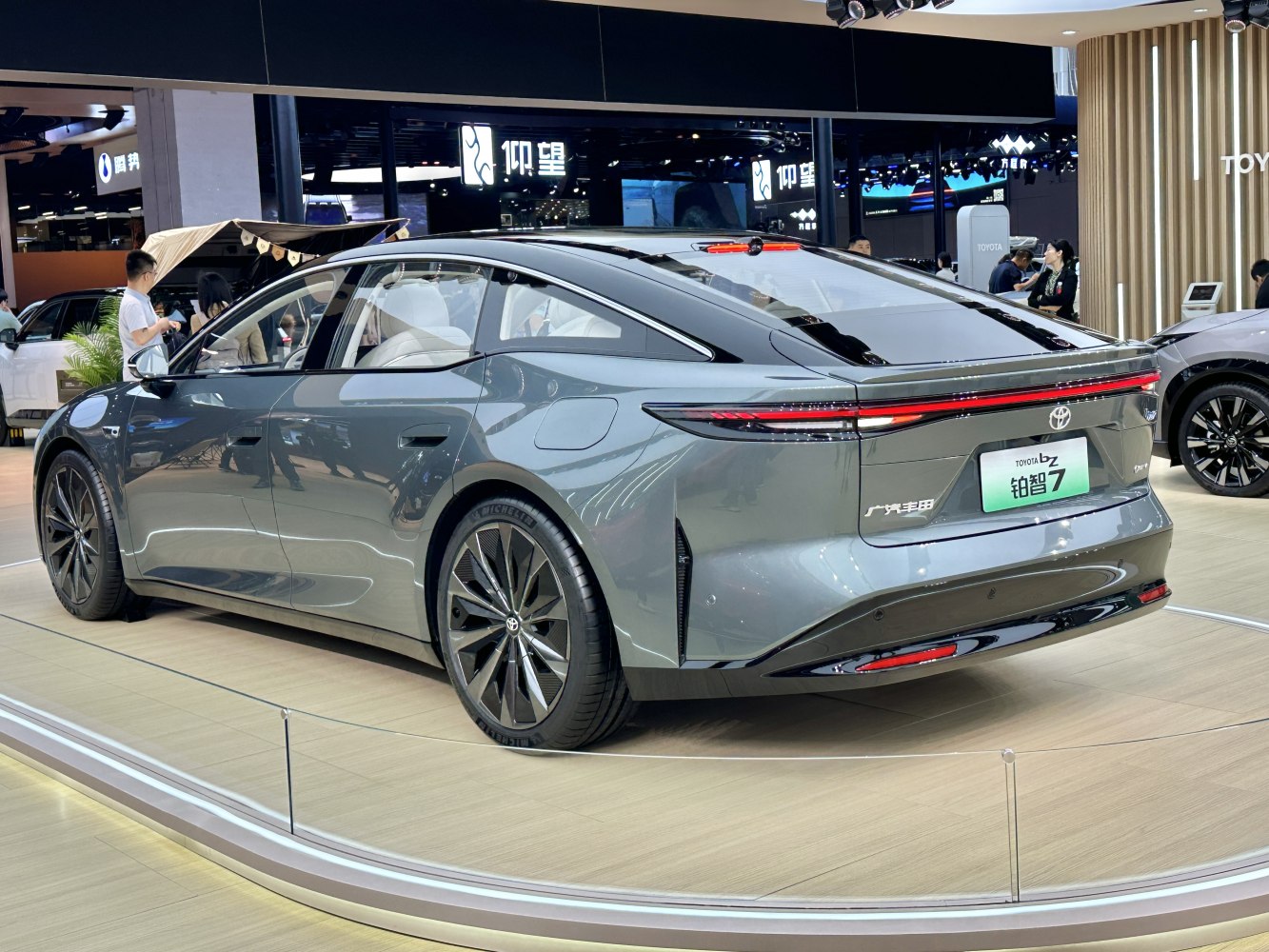 Sleek electric sedan rear with continuous LED taillight strip and aerodynamic shape
