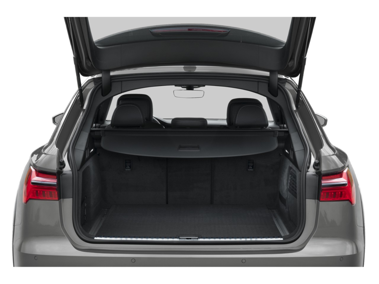 Spacious rear cargo area with open hatch and retractable cover
