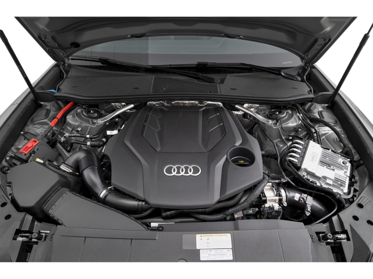Engine bay with Audi emblem on engine cover and modern components