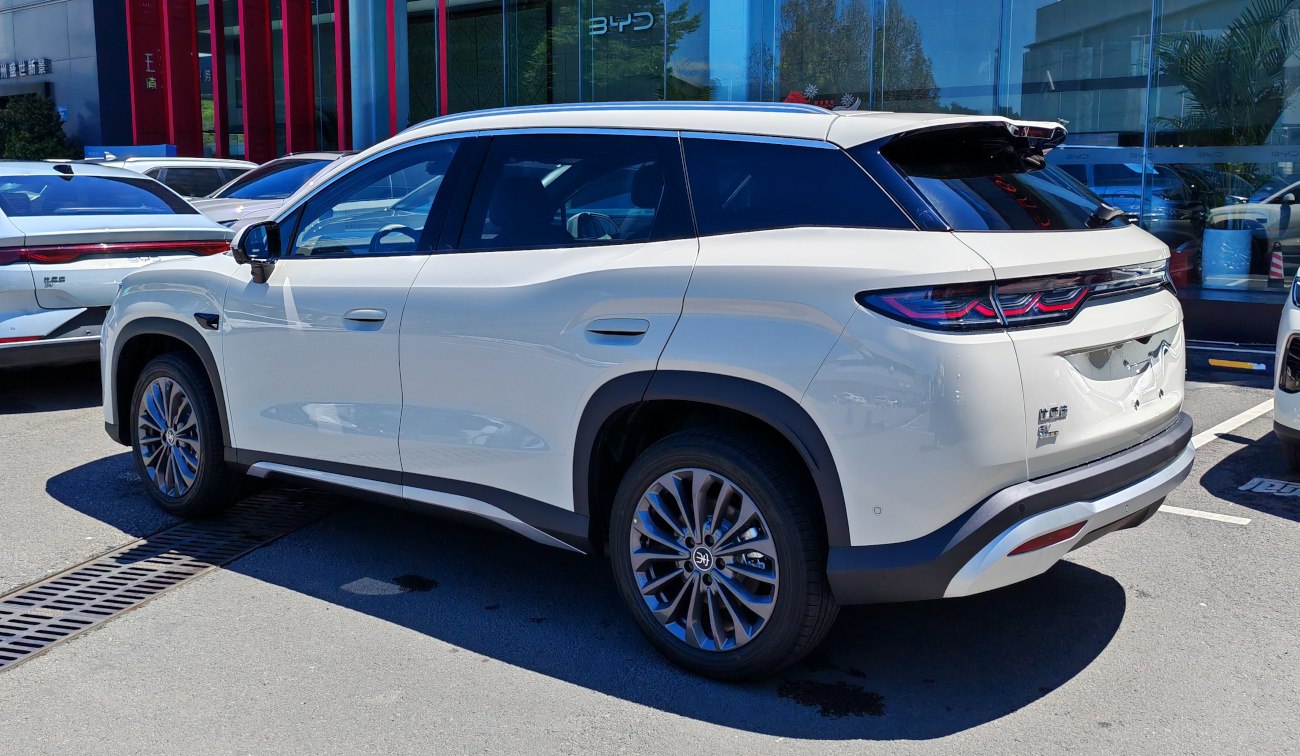 Rear and side view of white SUV with modern taillights and aerodynamic shape