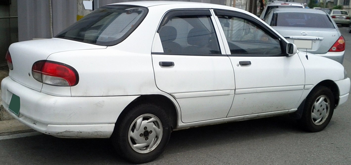 Rear-side profile of a 1994 sedan with distinctive taillights