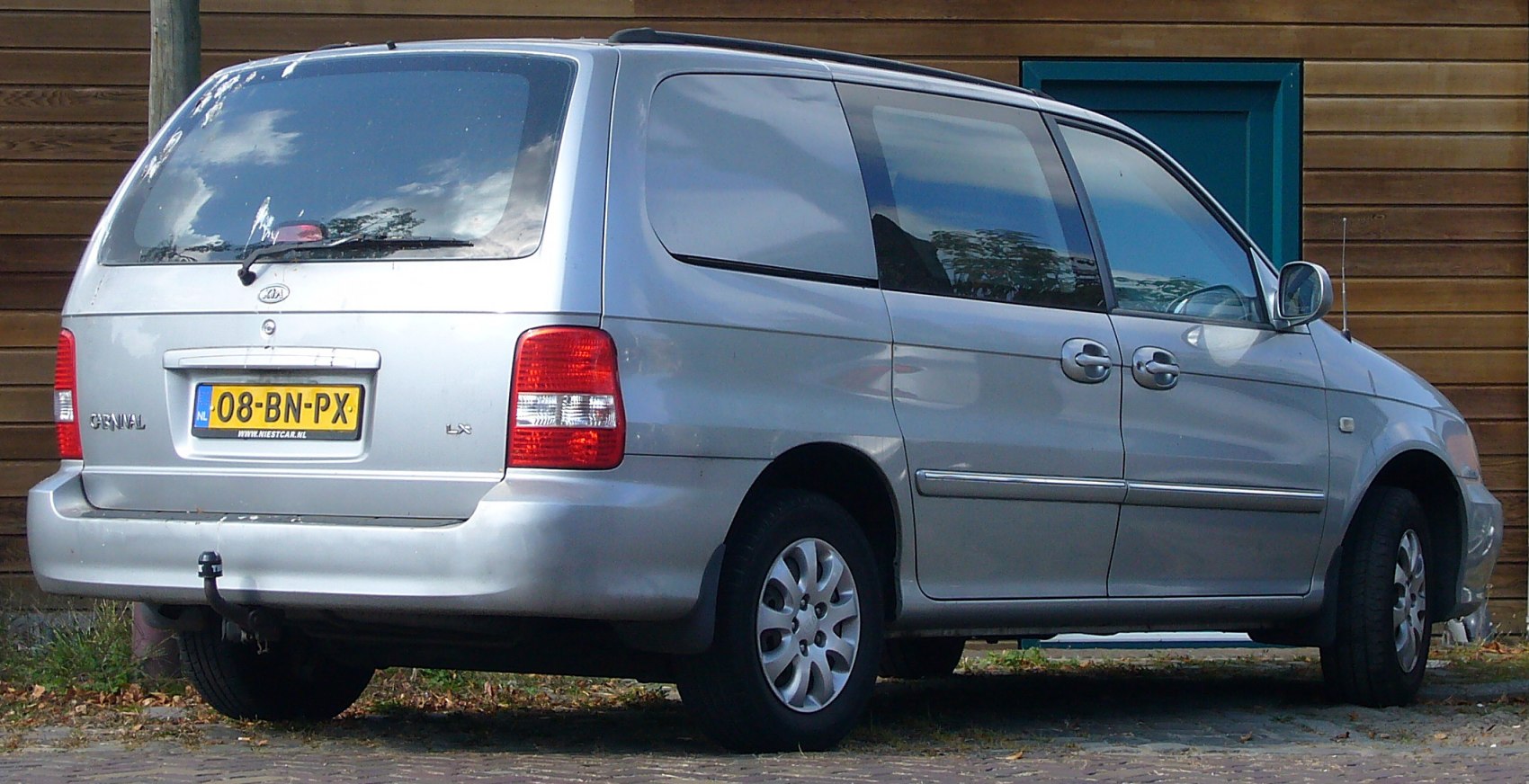 Minivan rear view with sliding doors and large windows