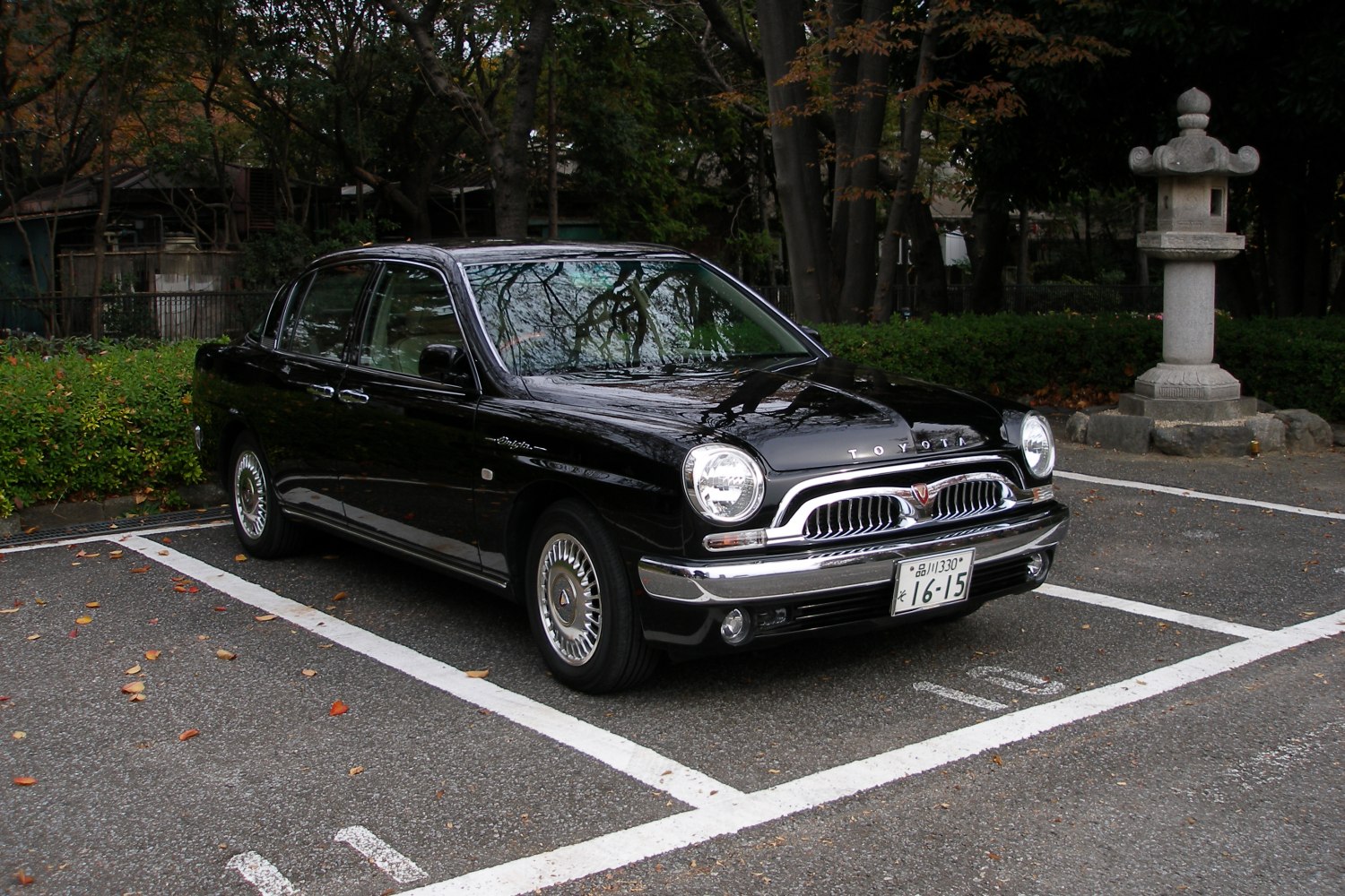 Retro-styled sedan with vintage grille and round headlights