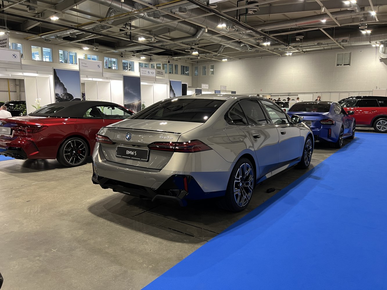 Luxury sedan rear with LED taillights and sporty twin exhausts