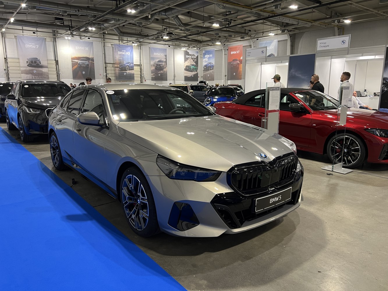 Front view of 2024 BMW 5 Series sedan with black kidney grille