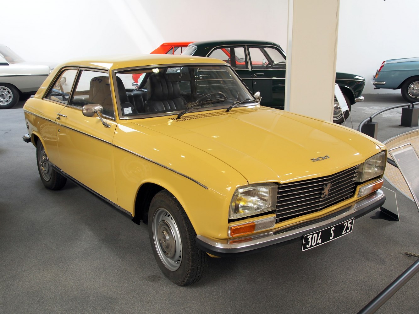Yellow coupe with rectangular headlights and chrome front bumper