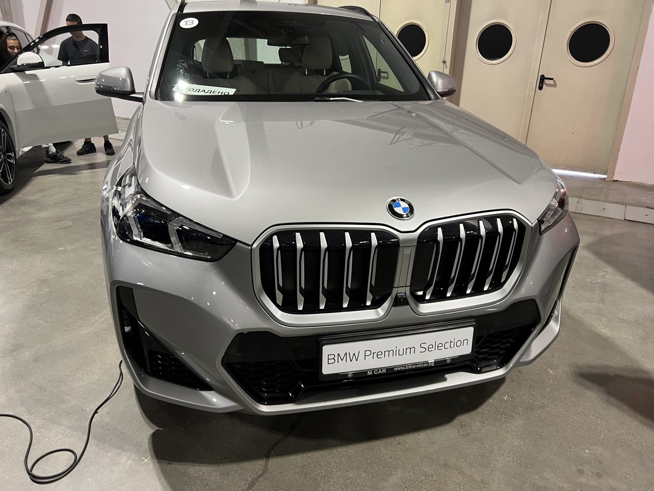 Front end showing kidney grille and headlights of modern SUV