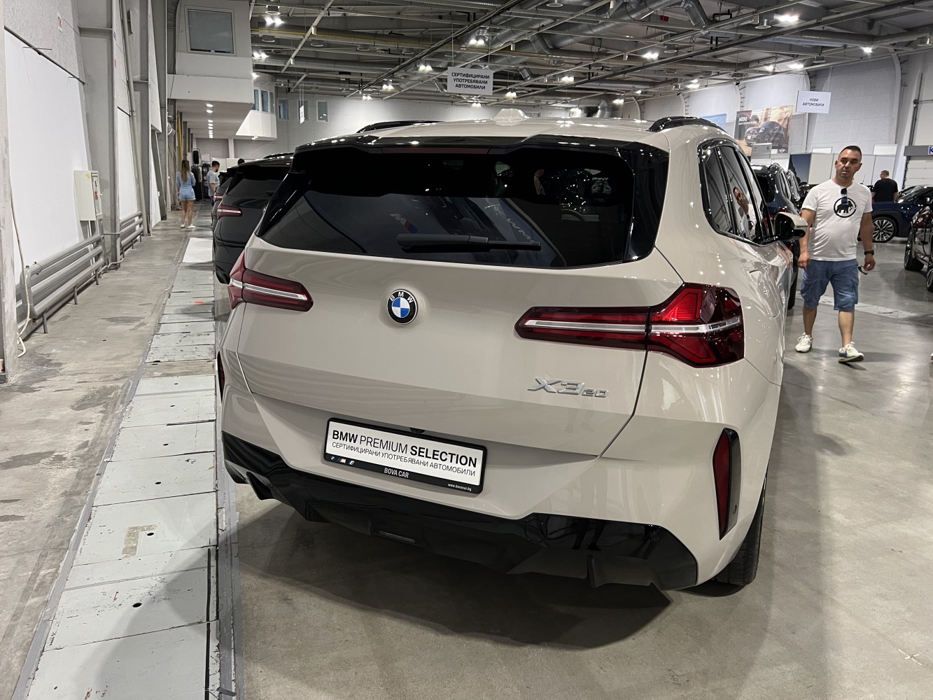 Rear view of white SUV with LED taillights and modern rear window design