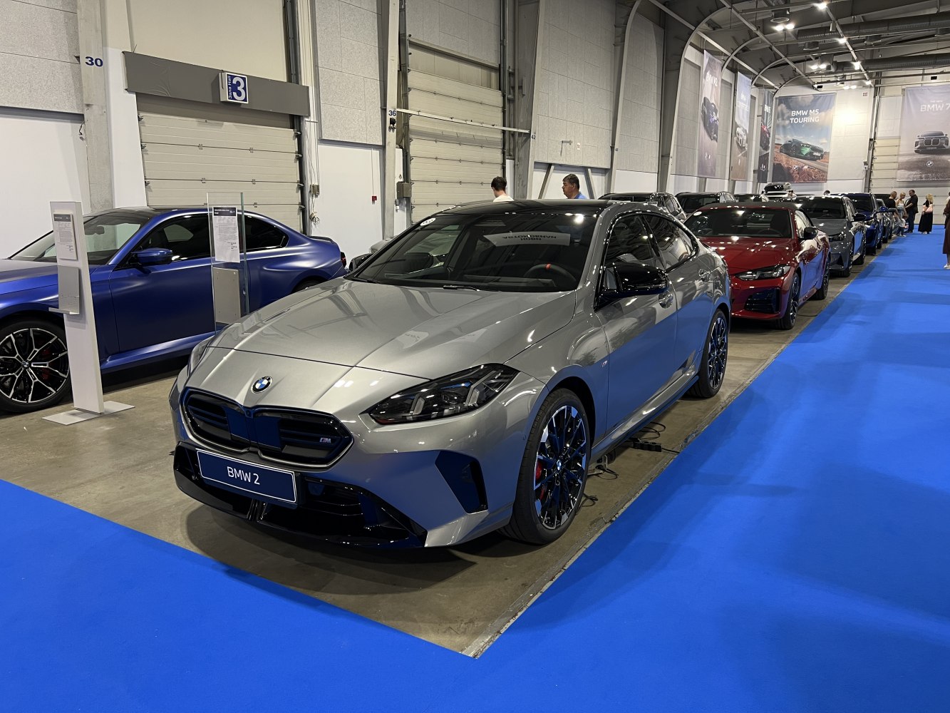 Sporty 4-door coupe with black grille and alloy wheels