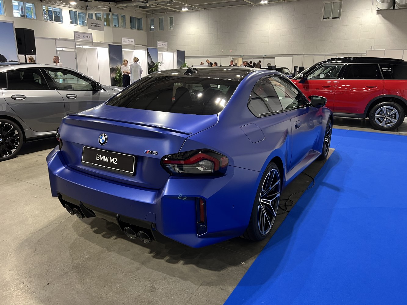 Rear view, quad exhaust, sporty coupe, matte blue finish