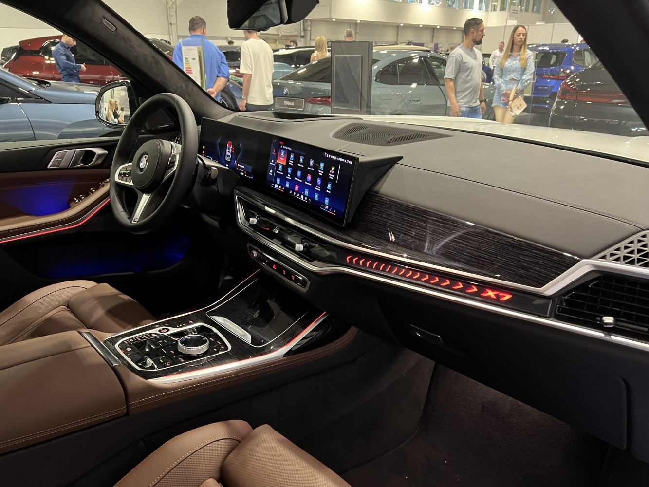 Luxury car interior with dual digital screens and ambient lighting