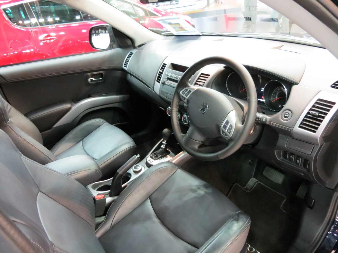 Steering wheel, dashboard, front leather seats interior view