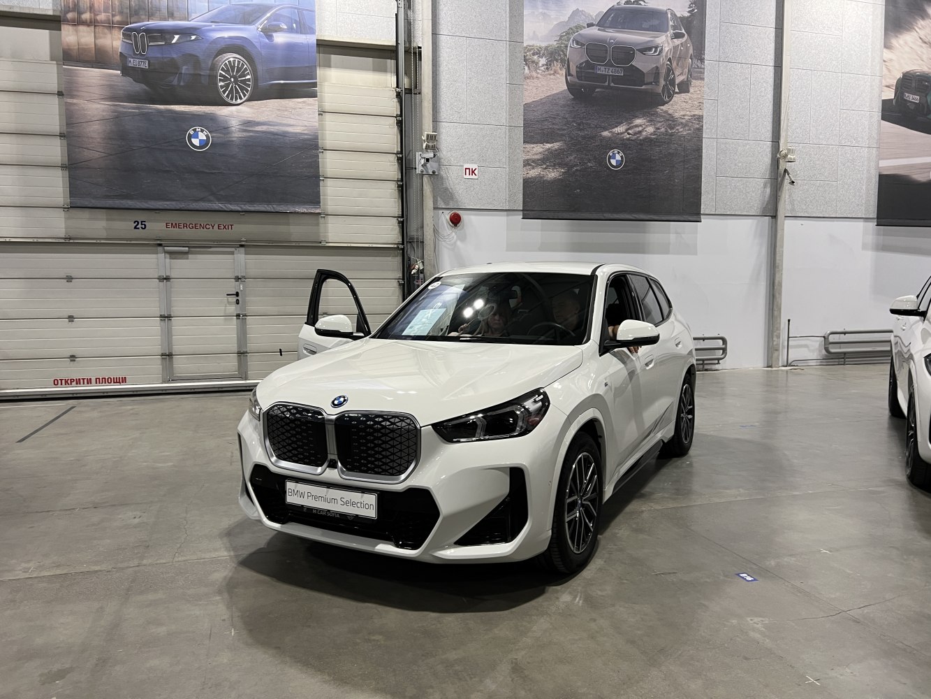 Large kidney grille and LED headlights on front of white SUV