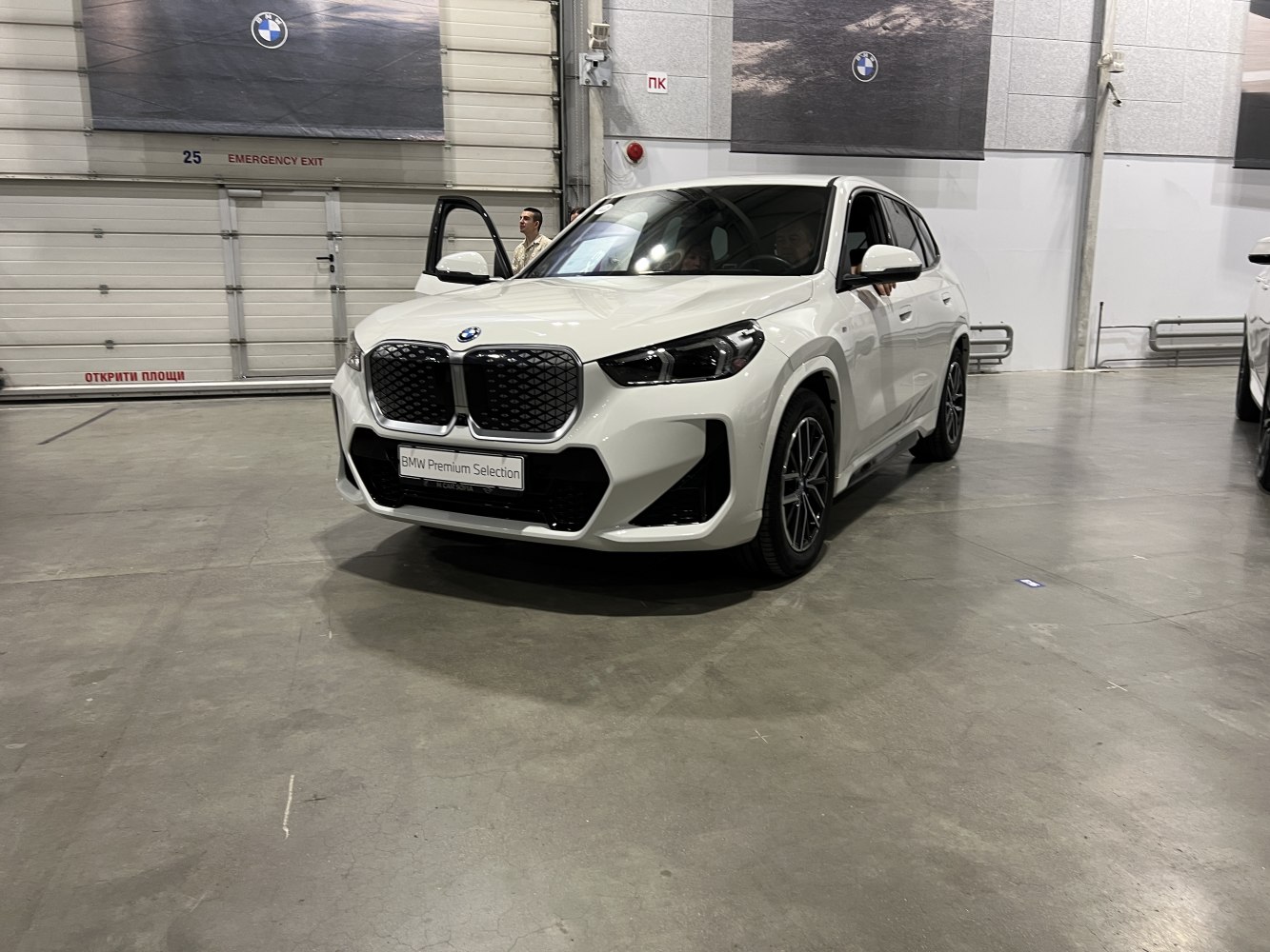 Front view with large kidney grille and sleek headlights