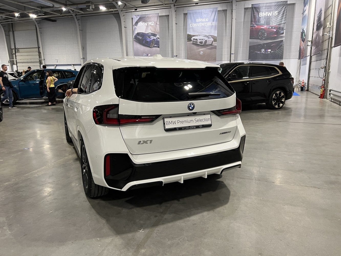 Rear view of white SUV with LED taillights and sporty bumper