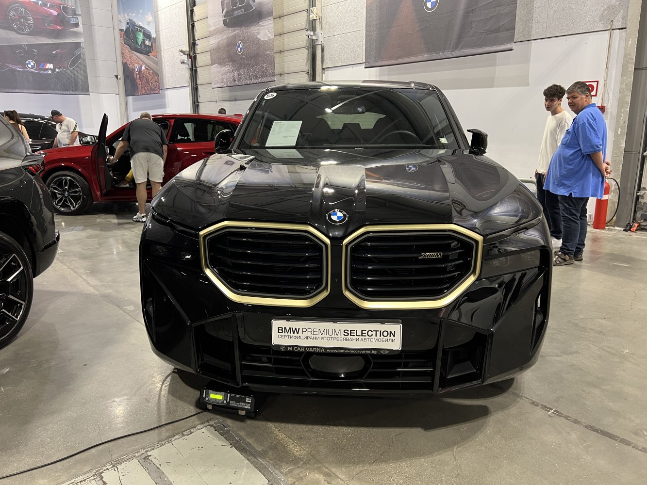 Front view with signature dual kidney grille and aggressive hood design