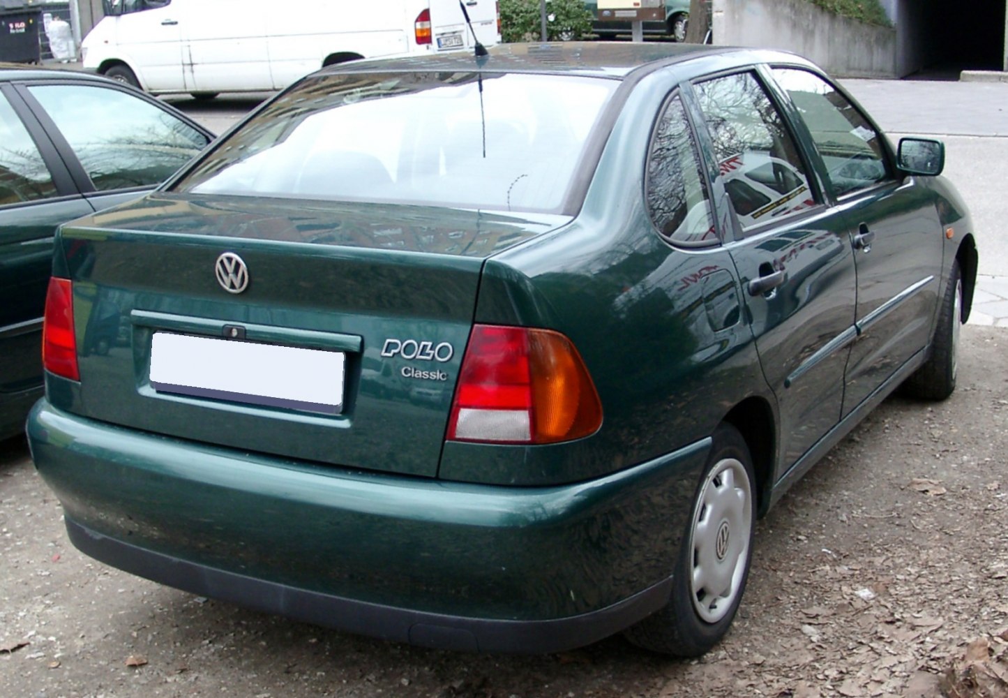 Rear and side view of classic sedan with distinct taillights and smooth body lines