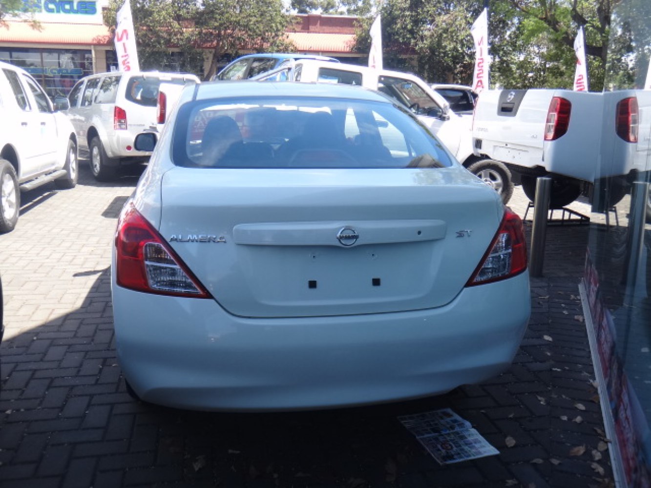 Rear view of a sedan with sharp taillights and trunk emblem