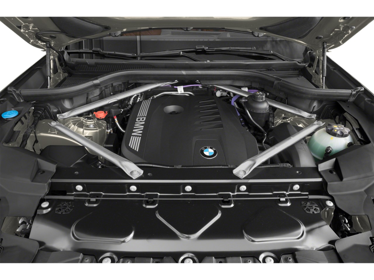 Engine bay with BMW-branded engine cover and structural support rods