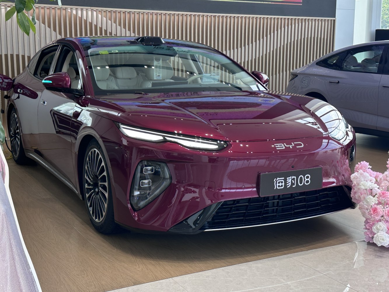 Sleek electric sedan with LED headlights and aerodynamic front styling