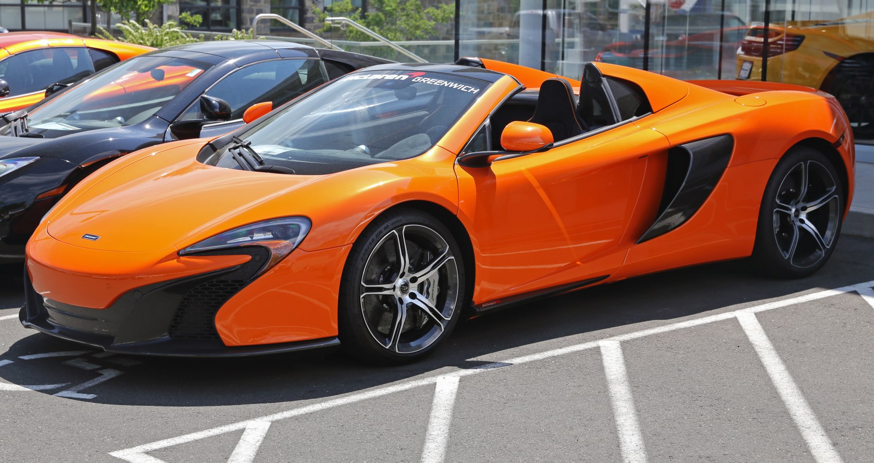 Convertible sports car with aerodynamic design and racing wheels