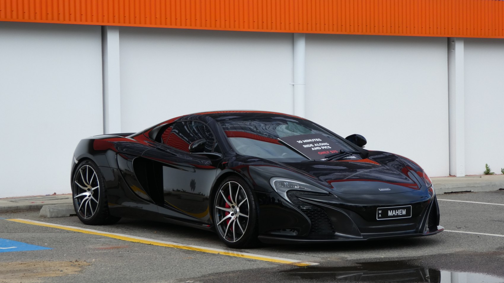 Black luxury sports coupe with aerodynamic body and performance wheels