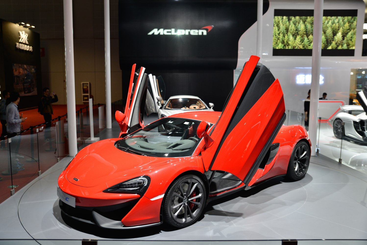 Red sports car with distinctive butterfly doors