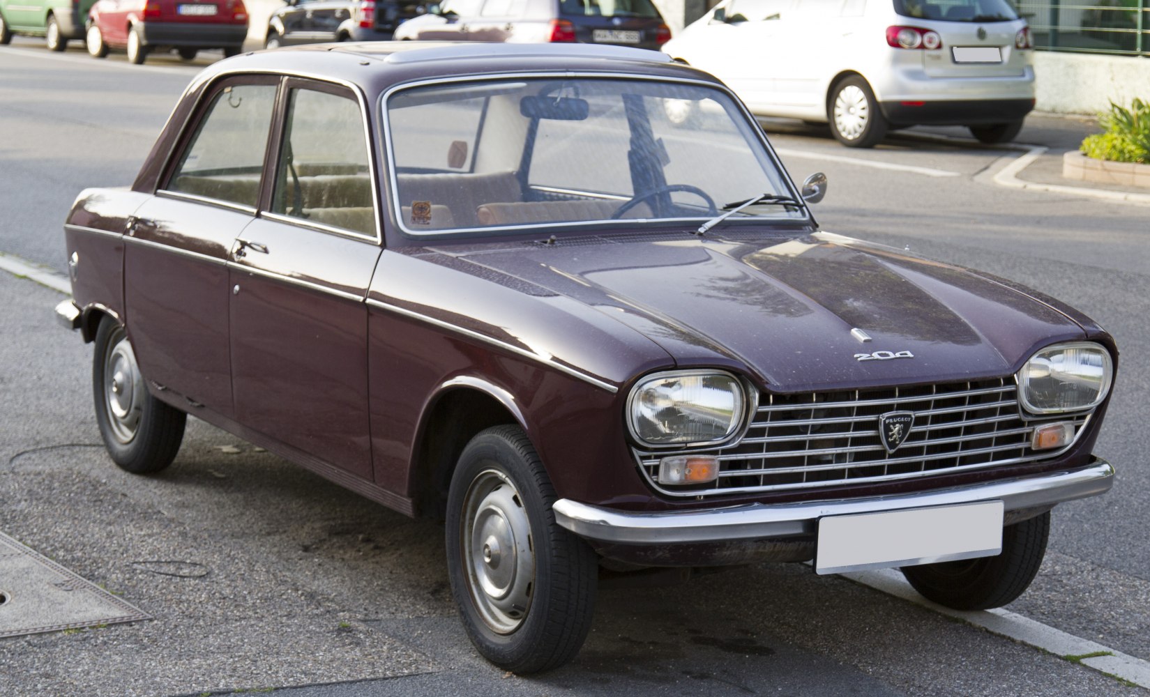 Vintage 1960s sedan with rectangular headlights and chrome grille