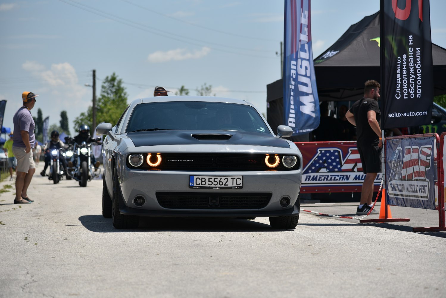 Muscle car front with dual halo headlights and hood scoop