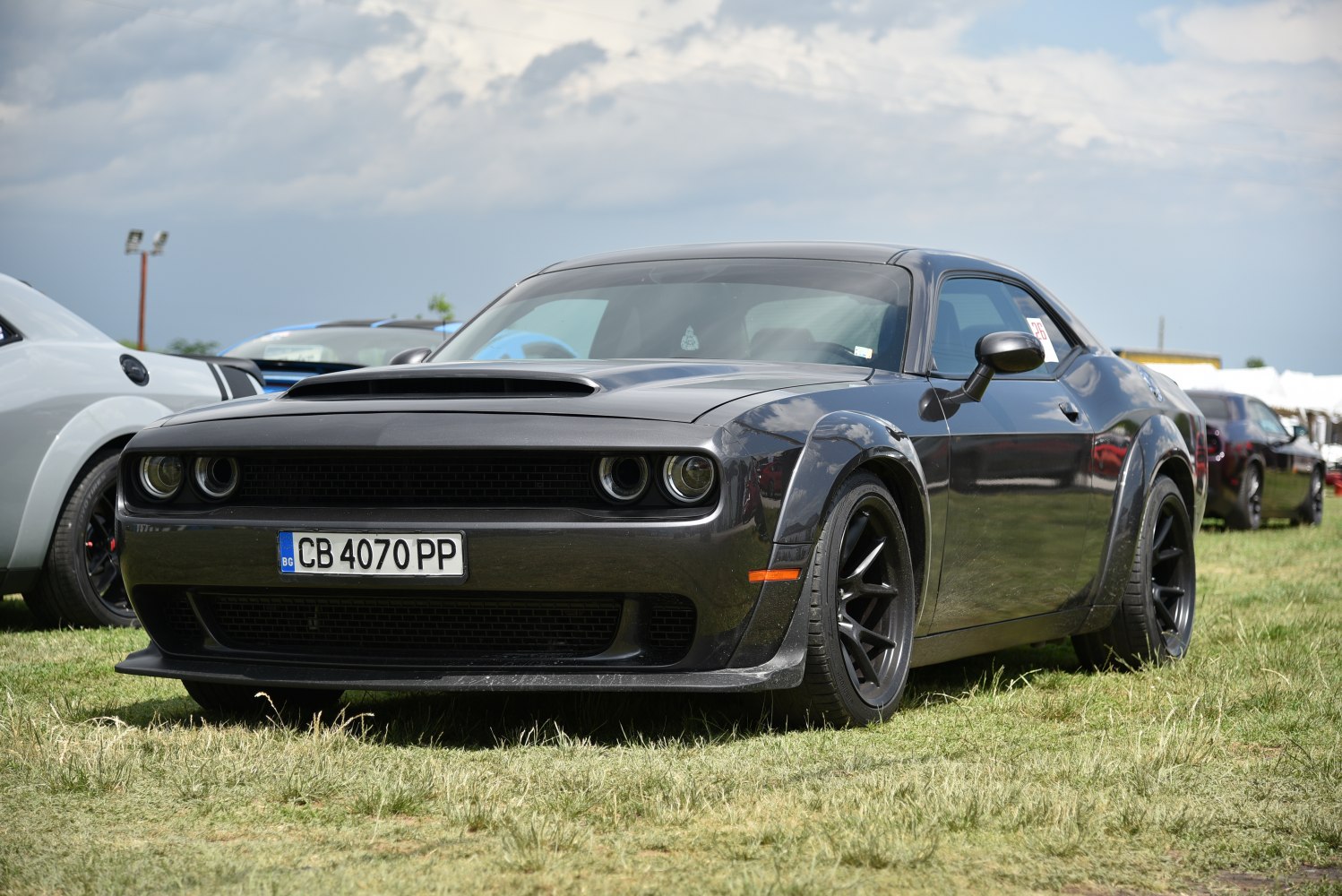 Muscle coupe with hood scoop and black alloy wheels