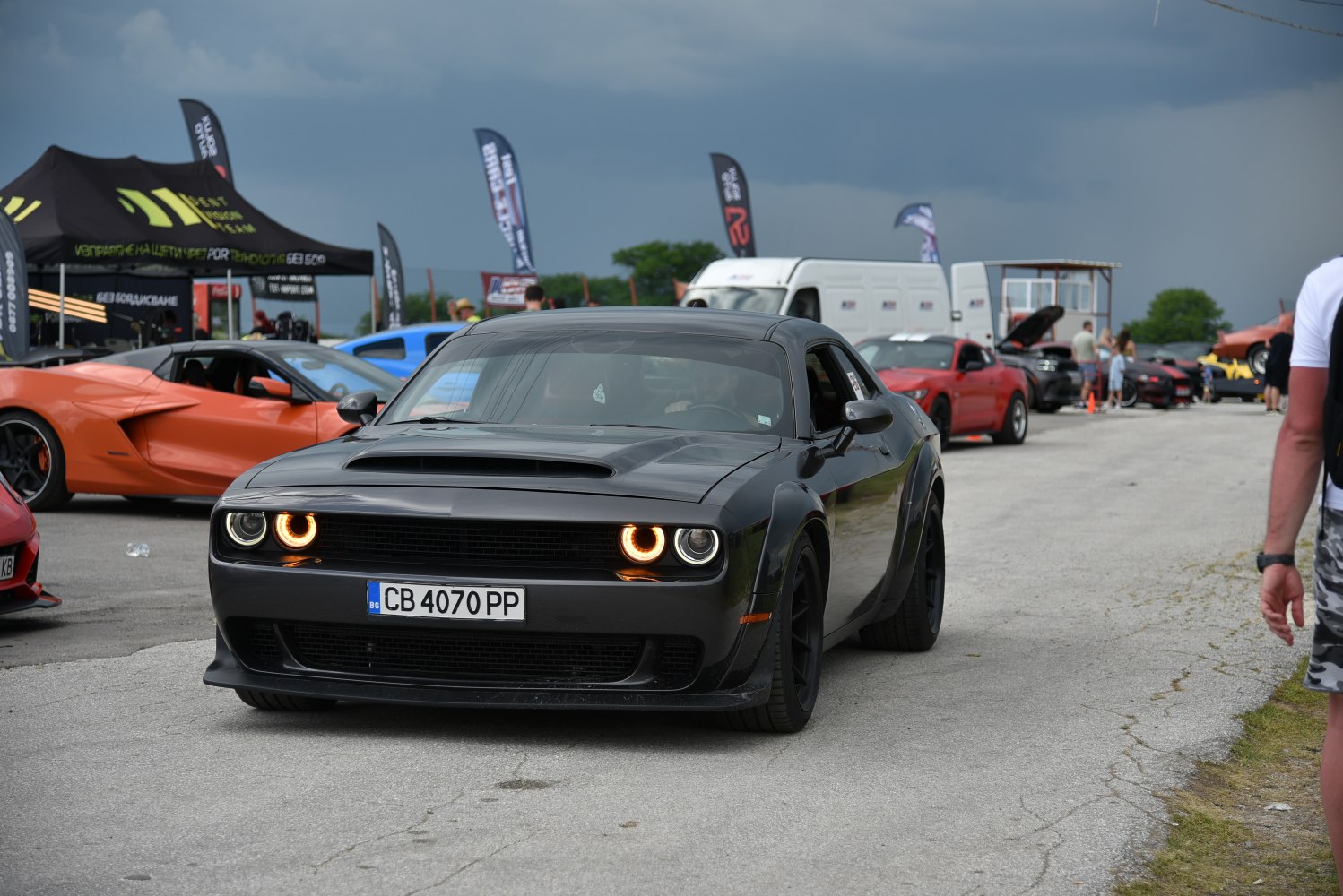 Front view of widebody muscle car with halo headlights