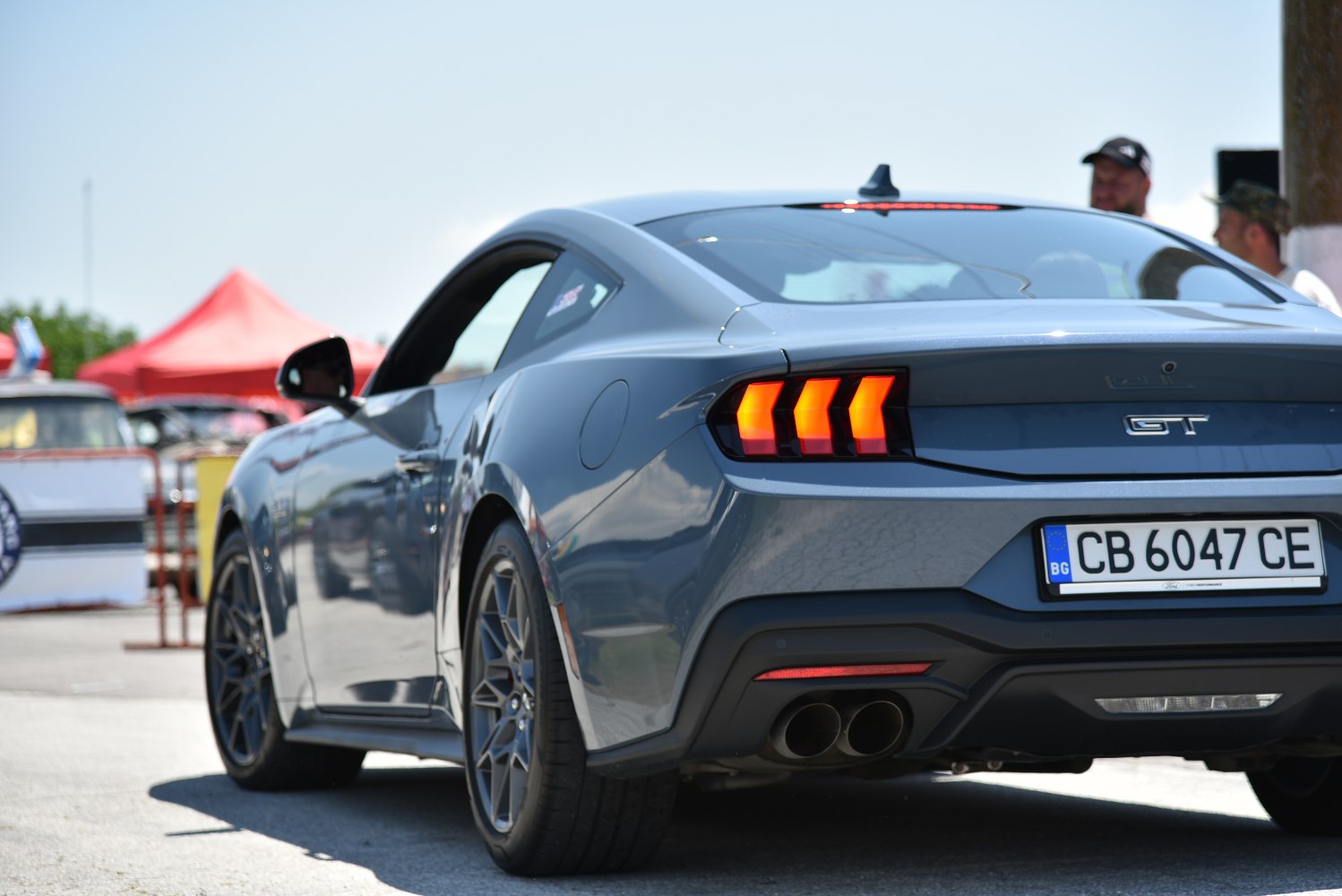 Rear view with triple-bar LED taillights and dual exhausts