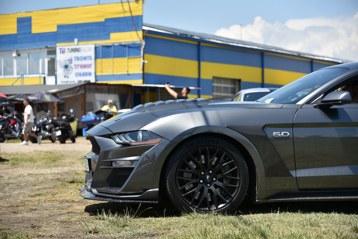 Front side close-up showing headlight and wheel