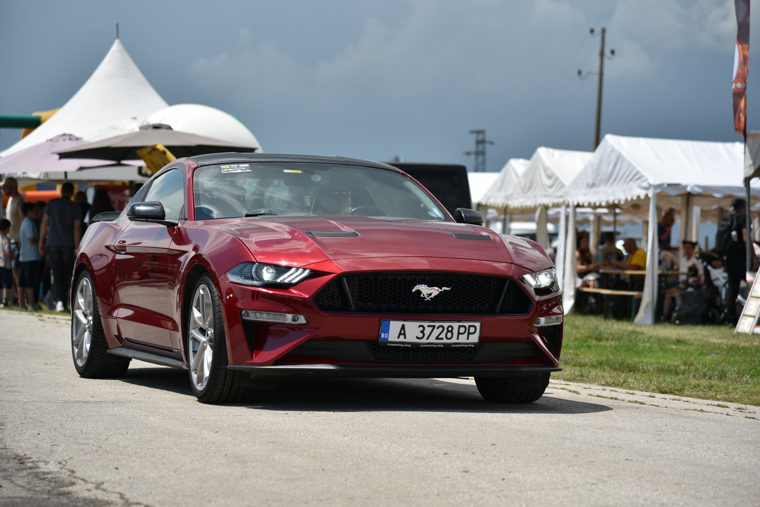 Front view with LED headlights and distinctive grille