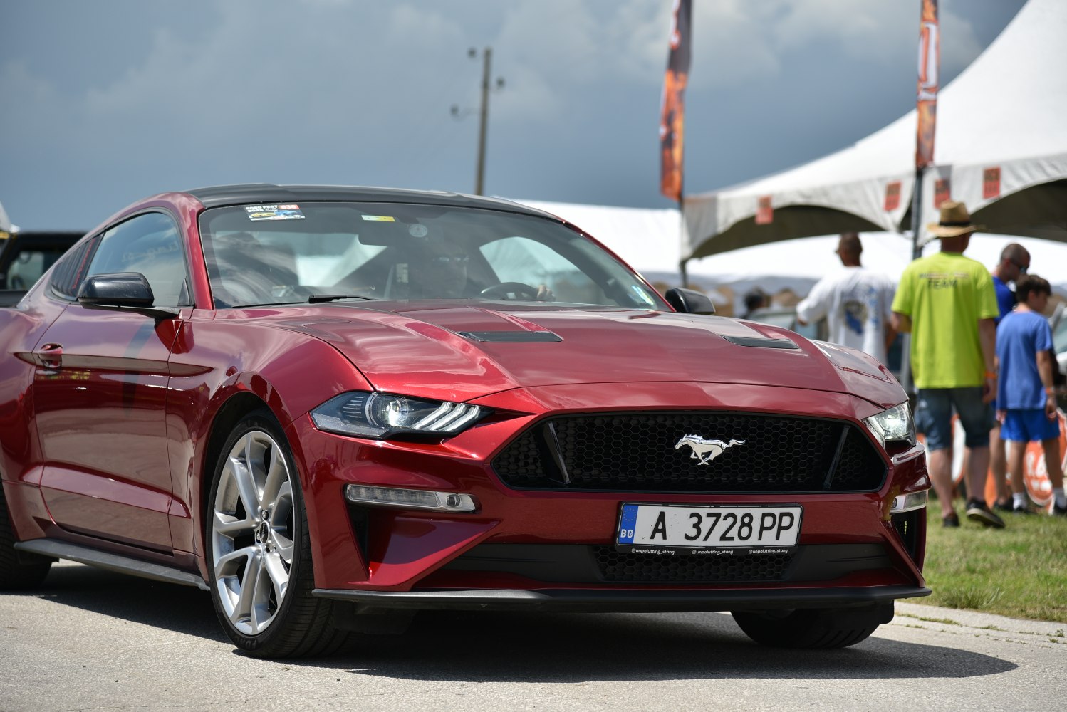 Aggressive front grille with LED headlights on a sleek sports coupe