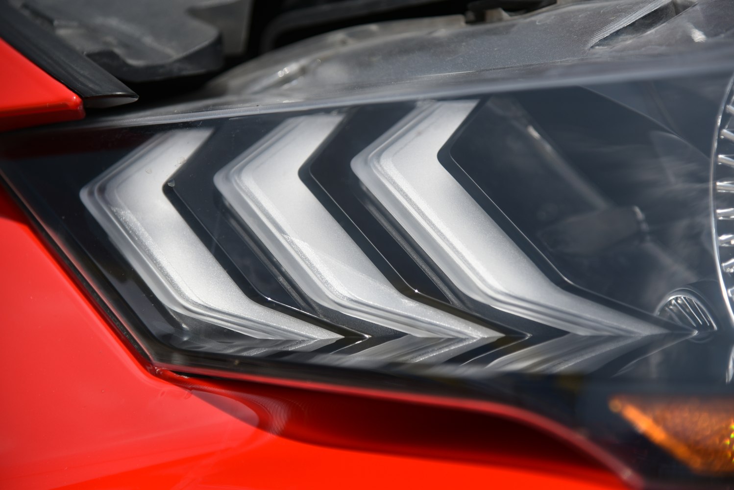 Sharp LED headlight with distinct sequential turn signals