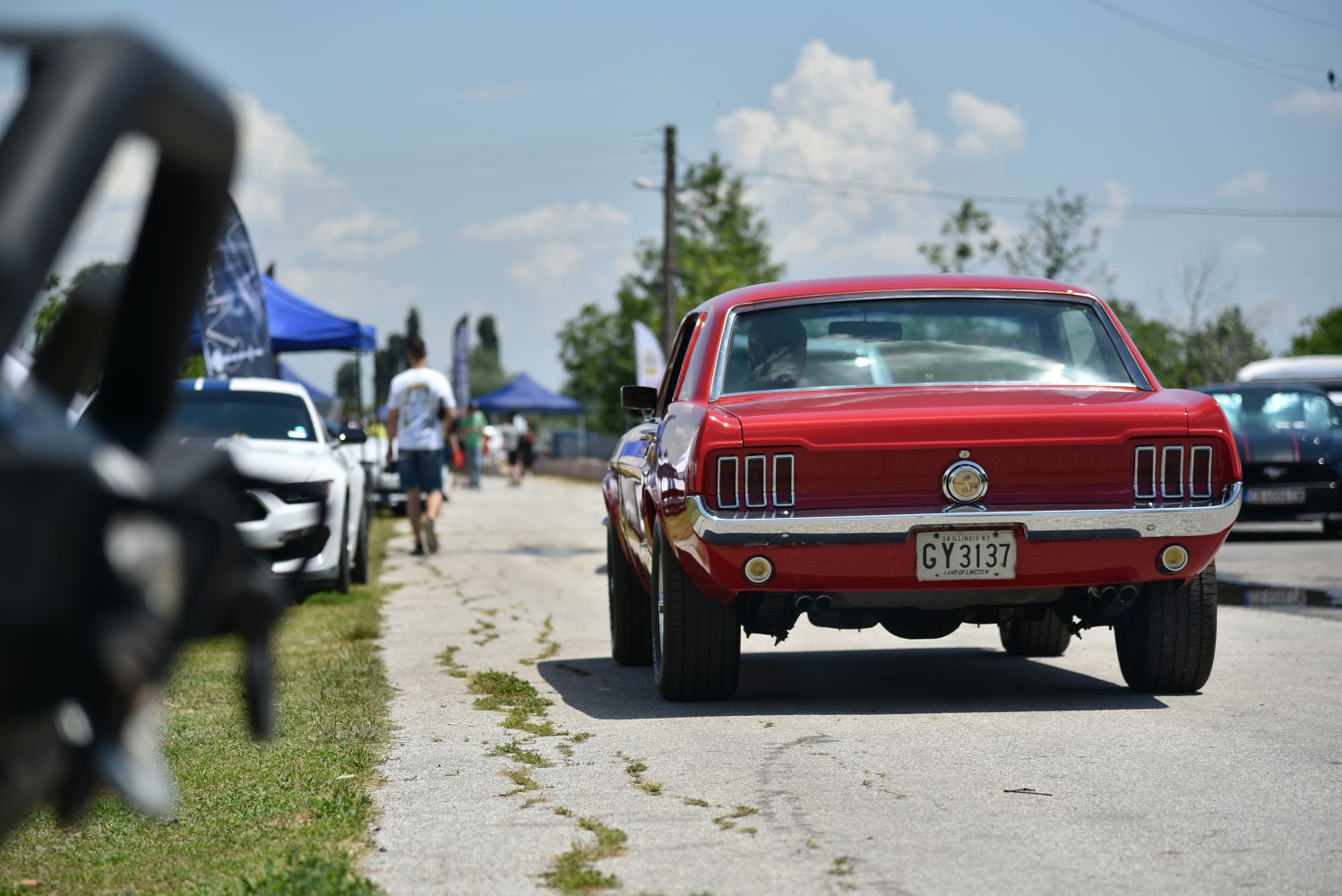 Rear view showing iconic triple taillights and wide tires