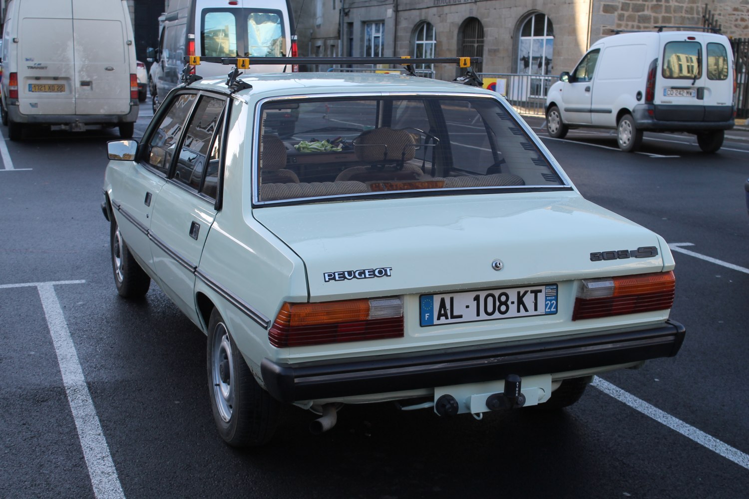 Vintage hatchback rear view with roof rack and tow hitch