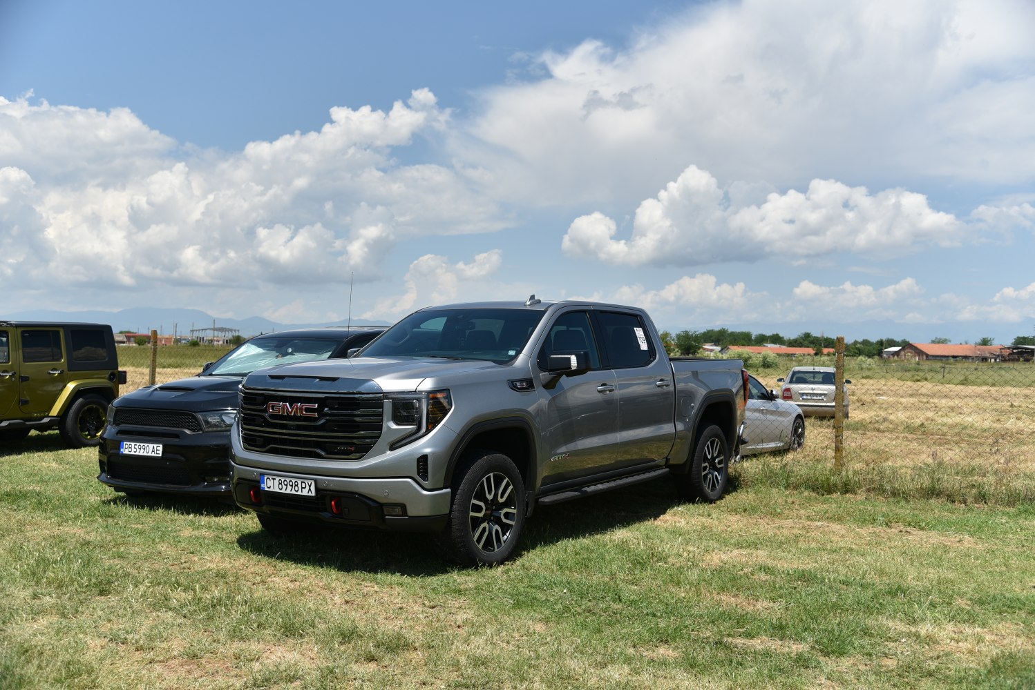 Pickup with bold grille, crew cab, short bed, rugged wheels