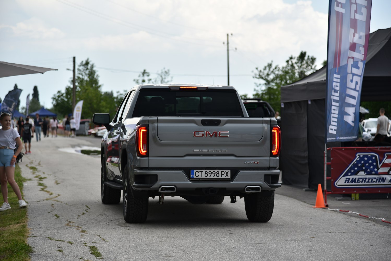 Rear view of a pickup truck with iconic tail lights and short cargo bed.