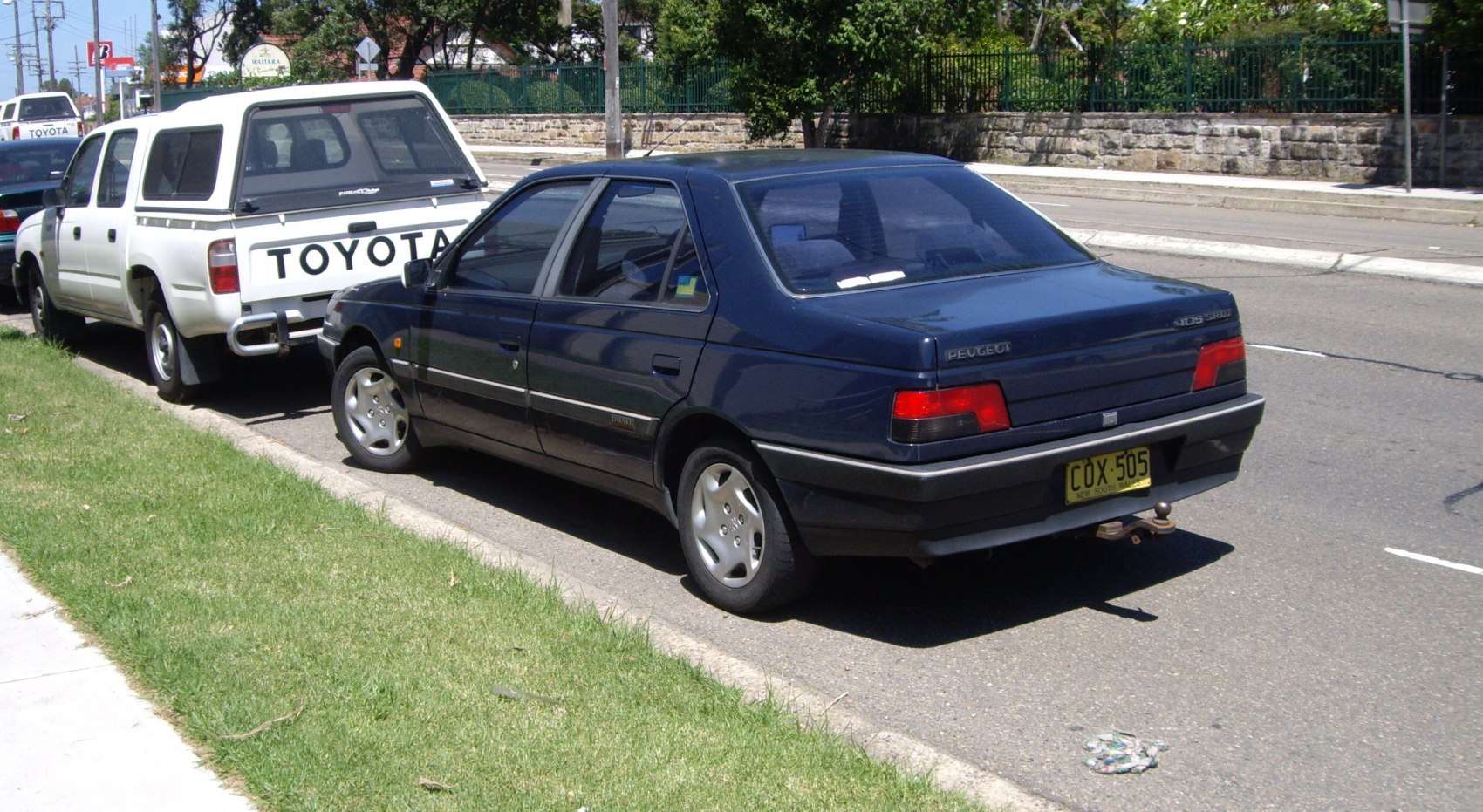 1992 sedan rear view with distinct tail lights and tow hitch