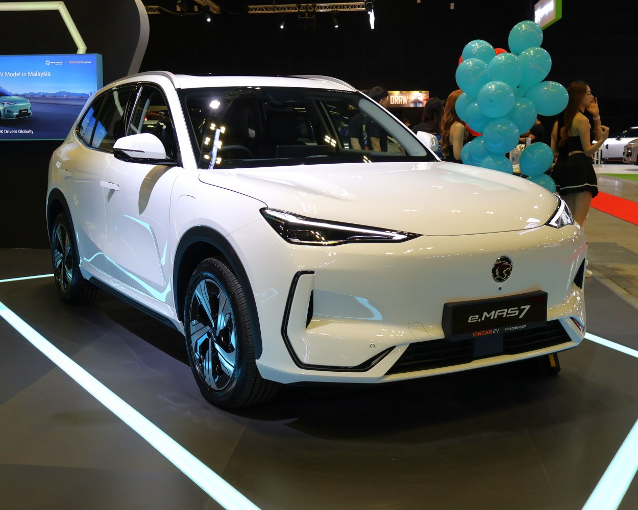 Front view of white electric SUV with sleek LED headlights and aerodynamic body