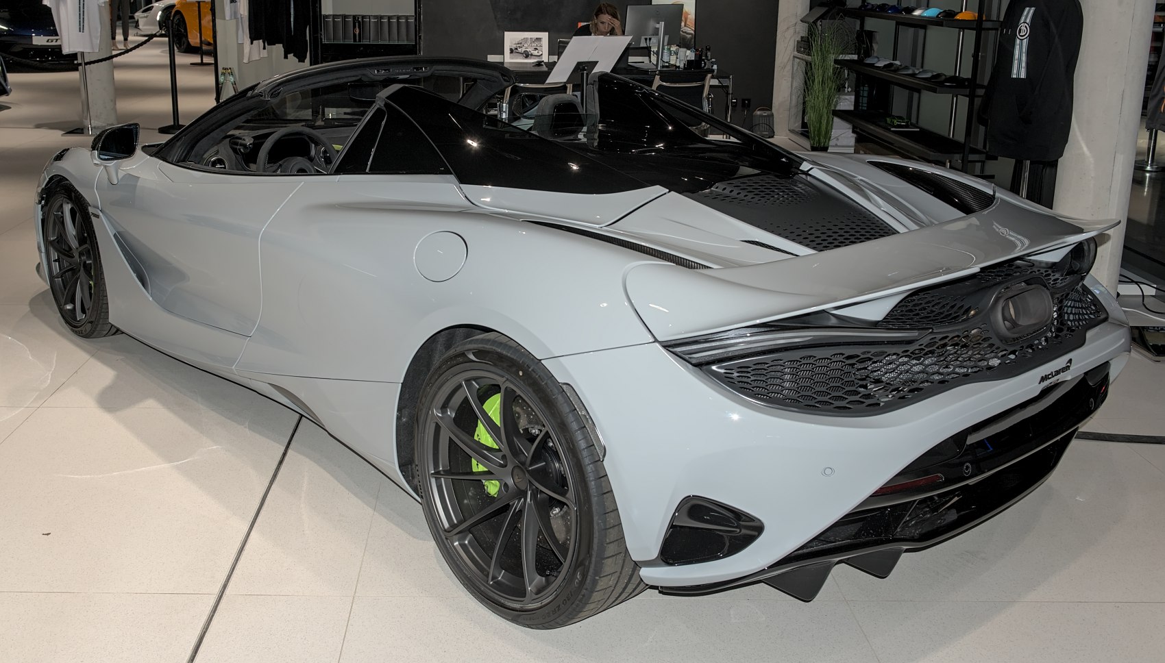 Rear view of convertible sports car with aerodynamic spoiler and open roof