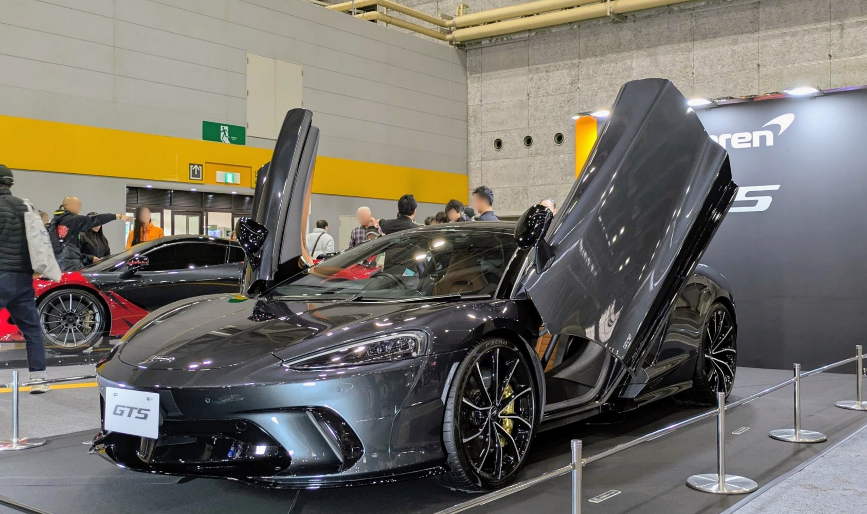 Sports car with butterfly doors and aerodynamic sleek design