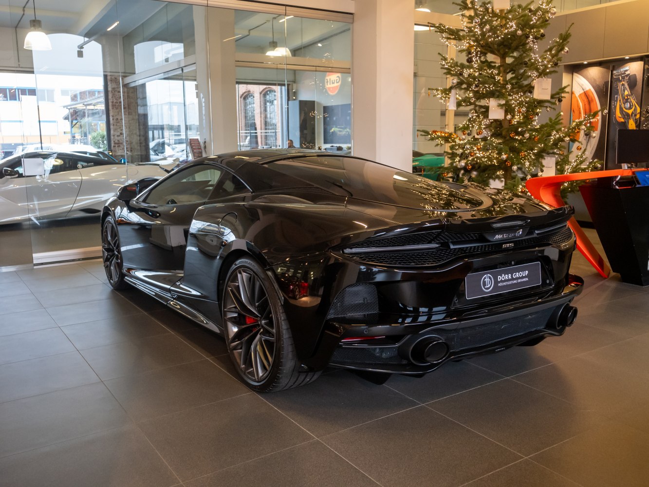 Sleek aerodynamic rear and sporty exhaust setup with stylish wheels