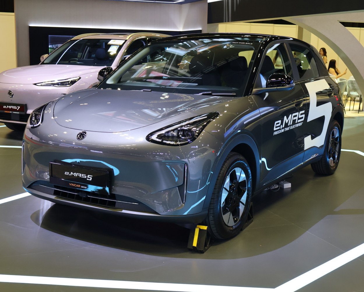 Sleek electric hatchback with smooth aerodynamic shape and prominent LED headlights