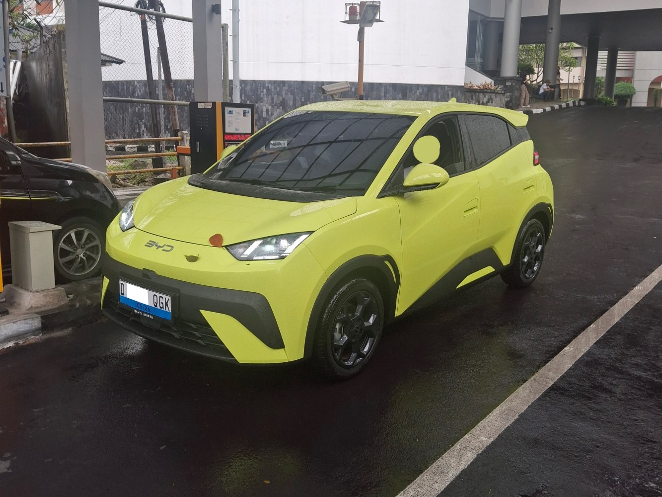 Front angled view of electric crossover with LED headlights and aerodynamic design
