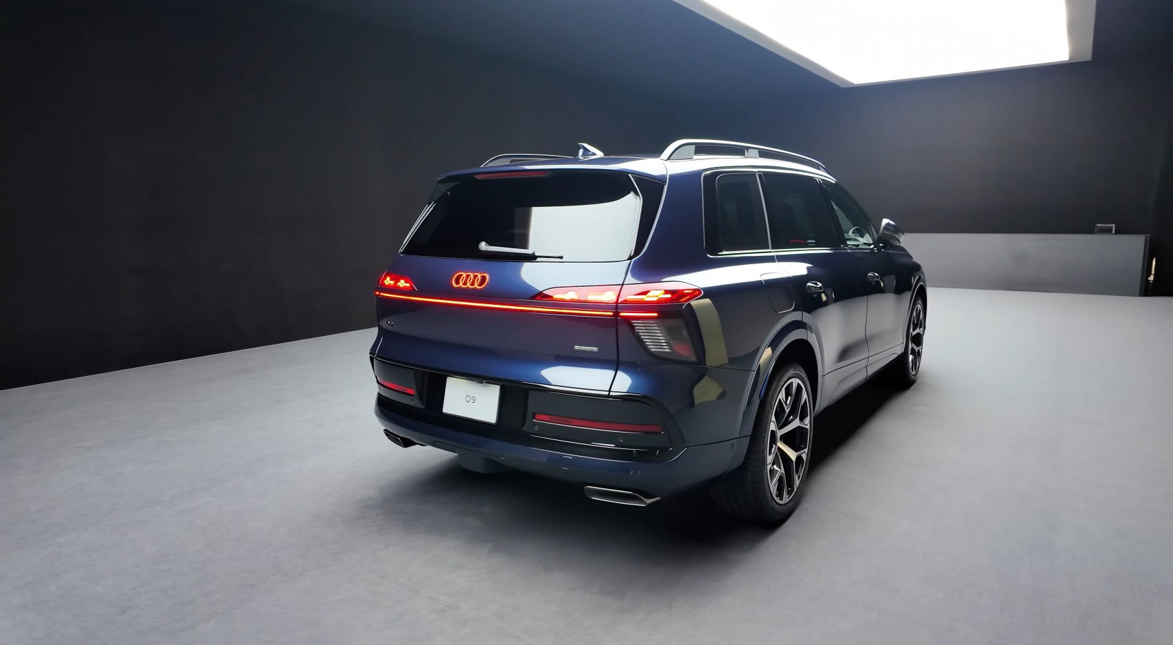 Rear view of luxury SUV with LED tail lights and dual exhaust