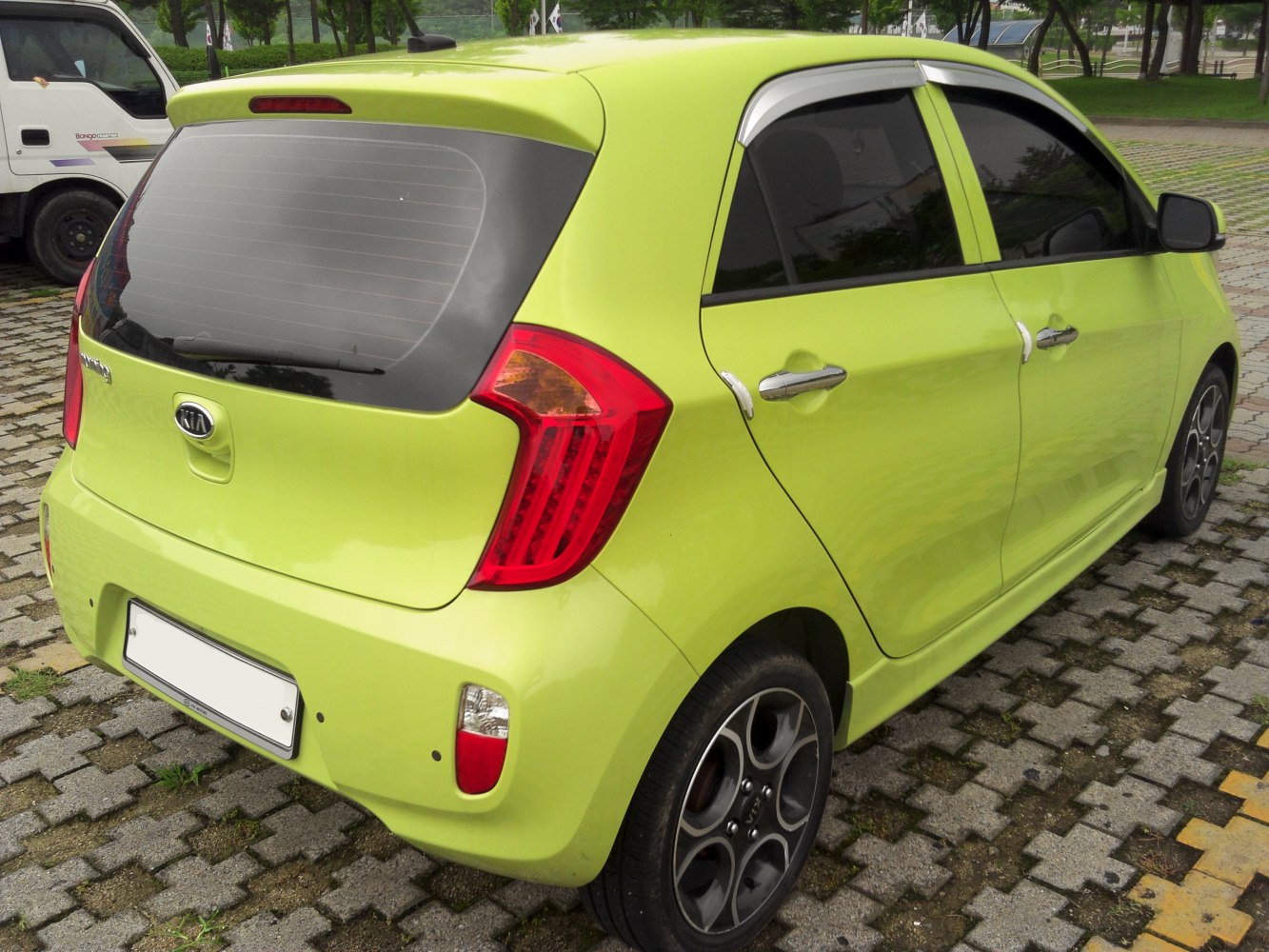 Compact hatchback rear with distinctive tail lights and alloy wheels
